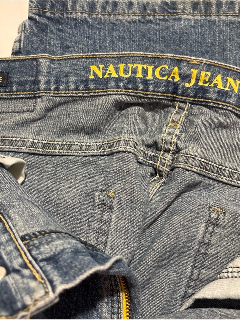 Nautica Men's Light Wash Blue Relaxed Jeans with Yellow Logo